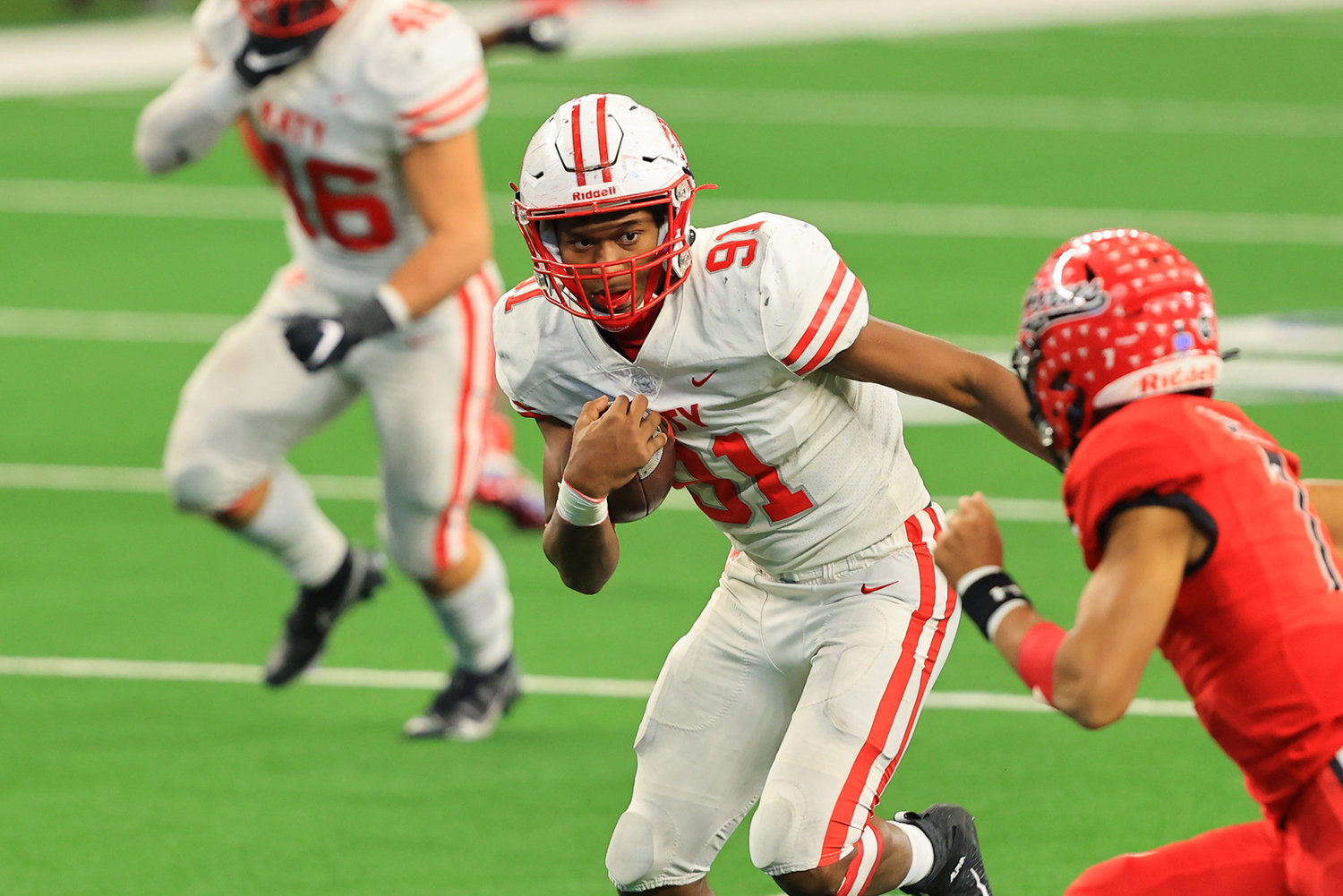 Katy senior defensive end Cal Varner III returns an interception for a touchdown during the fourth quarter of the Tigers' 51-14 win over Cedar Hill at AT&T Stadium on Saturday afternoon. Katy won the Class 6A-Division II state championship.