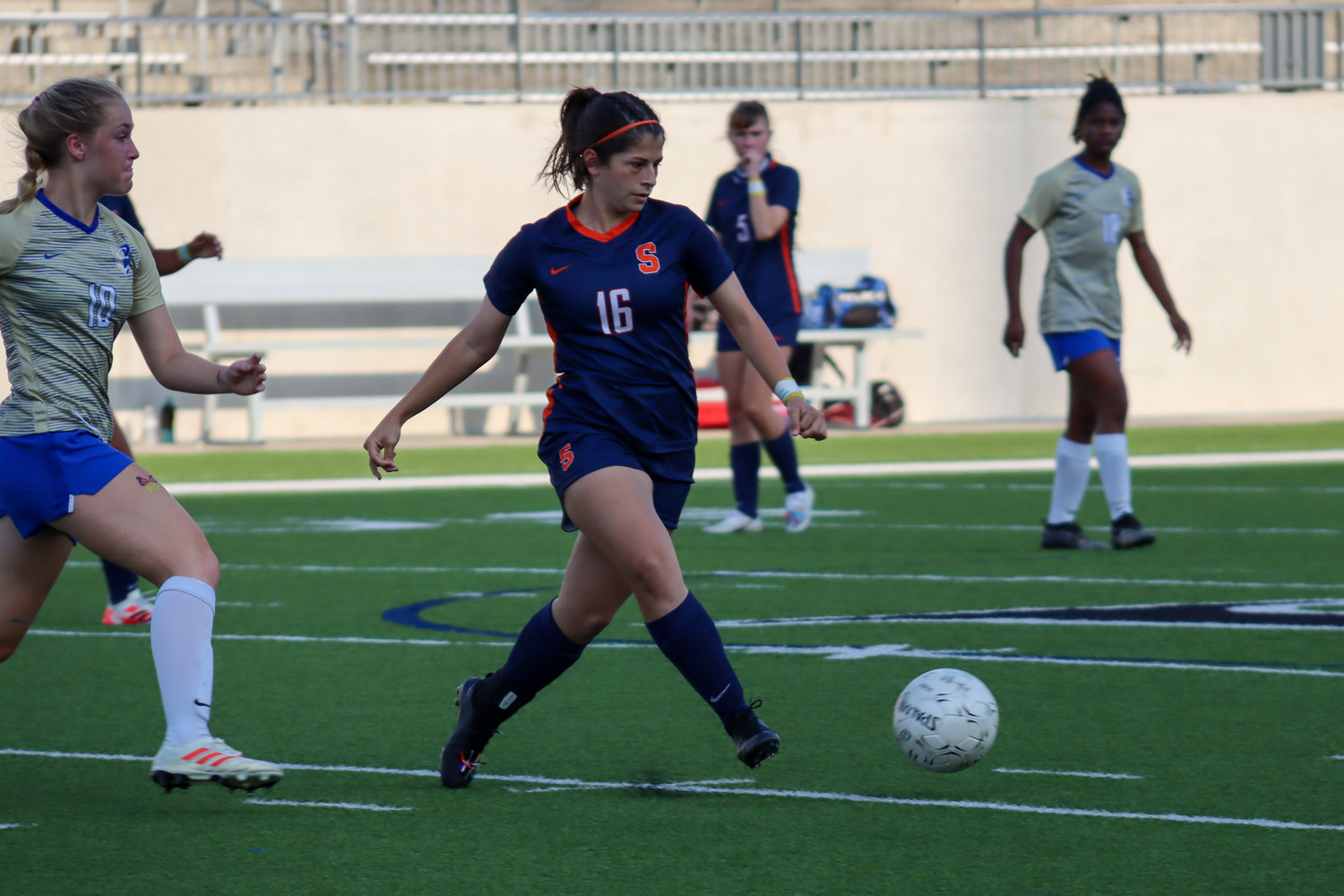 Seven Lakes senior midfielder Megan Vigil controls possession during the Spartans’ 7-0 Class 6A bi-district playoff win on Friday, March 26, at Legacy Stadium.