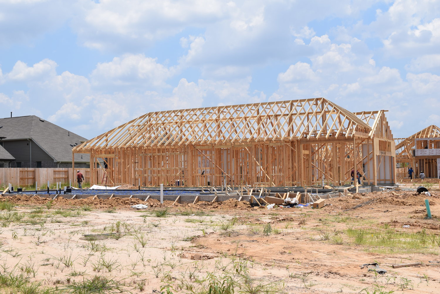 Workers continue to build homes in the Elyson subdivision along FM 529 in the northern portion of the Katy area. Builders have been hard-pressed to find lumber which experts say has increased in price by about 300% recently, in part due to the pandemic, though raw timber prices have remained steady.