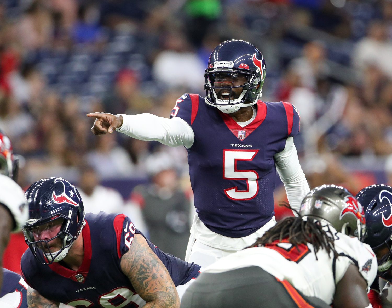 Houston Texans quarterback Tyrod Taylor (5) at the line of scrimmage during an NFL preseason game between the Houston Texans and the Tampa Bay Buccaneers on August 28, 2021 in Houston, Texas.
