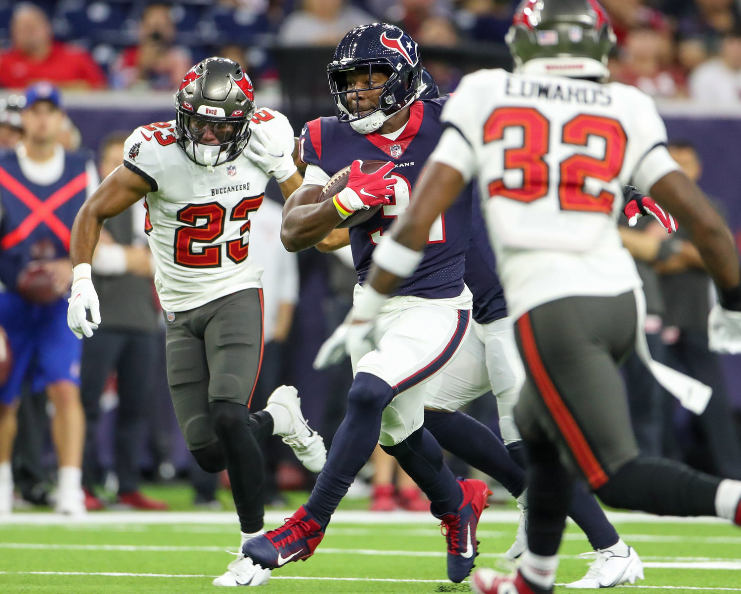 Houston Texans running back David Johnson (31) carries the ball during an NFL preseason game between the Houston Texans and the Tampa Bay Buccaneers on August 28, 2021 in Houston, Texas.