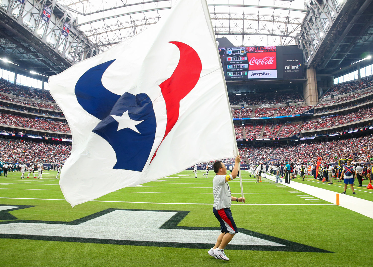A Houston Texans flag runner after a Texans touchdown during the first half of an NFL game between the Houston Texans and the Jacksonville Jaguars on September 12, 2021 in Houston, Texas.