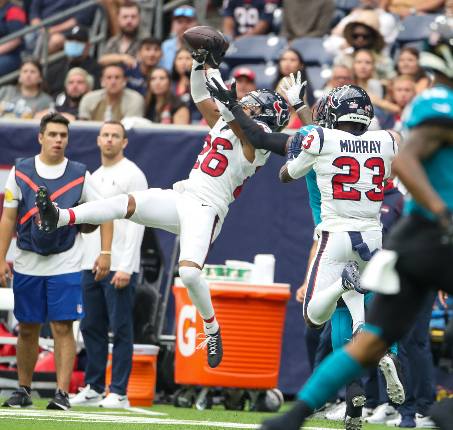 Houston Texans cornerback Vernon Hargreaves III (26) leaps to top a pass thrown by Jacksonville Jaguars quarterback Trevor Lawrence (16) during the first half of an NFL game between the Houston Texans and the Jacksonville Jaguars on September 12, 2021 in Houston, Texas.