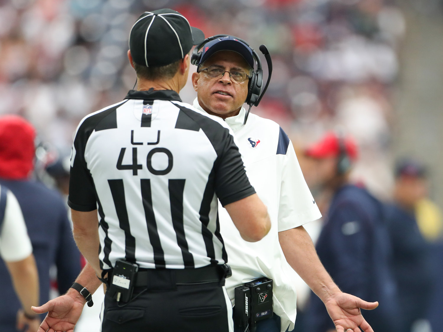 Houston Texans head coach David Culley talks with line judge Brian Bolinger (40) after an offensive pass interference call against the Texans during the first half of an NFL game between the Houston Texans and the Jacksonville Jaguars on September 12, 2021 in Houston, Texas.