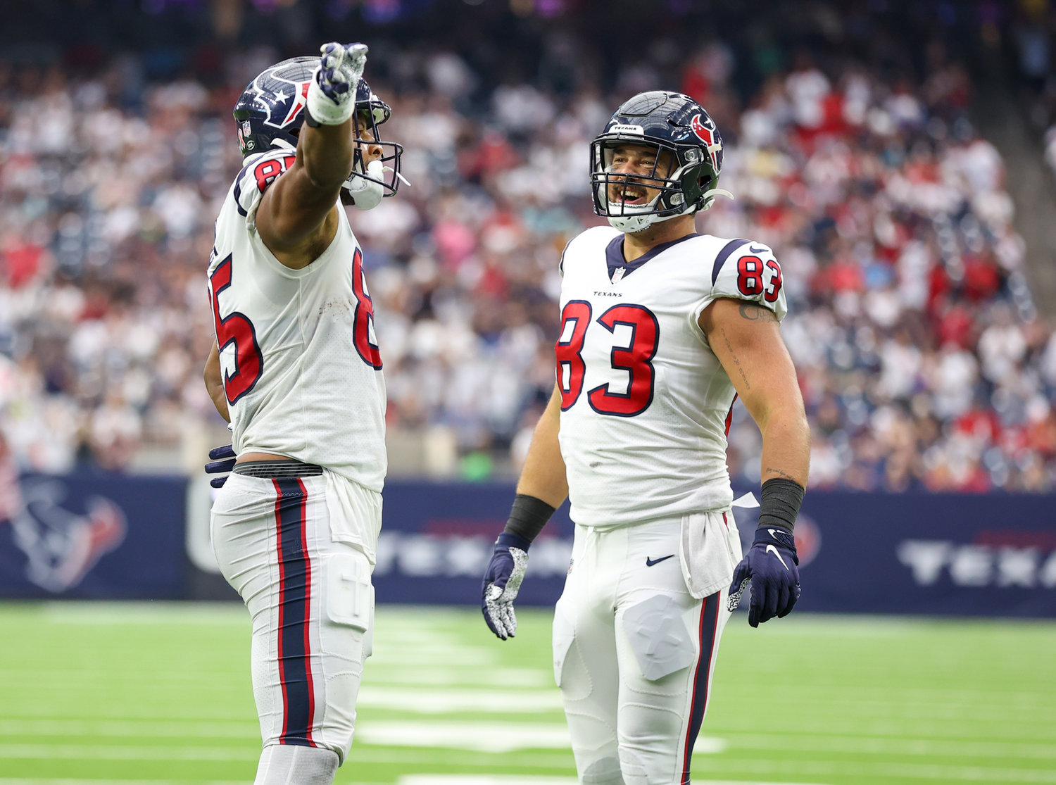 Houston Texans tight end Pharaoh Brown (85) gestures after picking up a first down as tight end Antony Auclair (83) looks on during the second half of an NFL game between the Houston Texans and the Jacksonville Jaguars on September 12, 2021 in Houston, Texas.