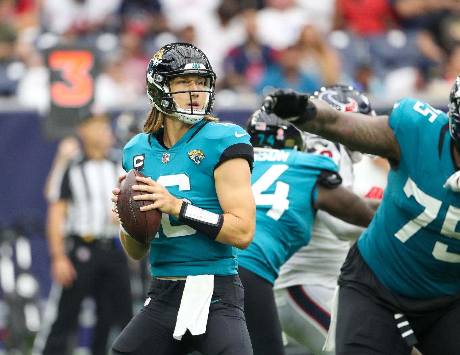 Jacksonville Jaguars quarterback Trevor Lawrence (16) looks to pass during the second half of an NFL game between the Houston Texans and the Jacksonville Jaguars on September 12, 2021 in Houston, Texas.