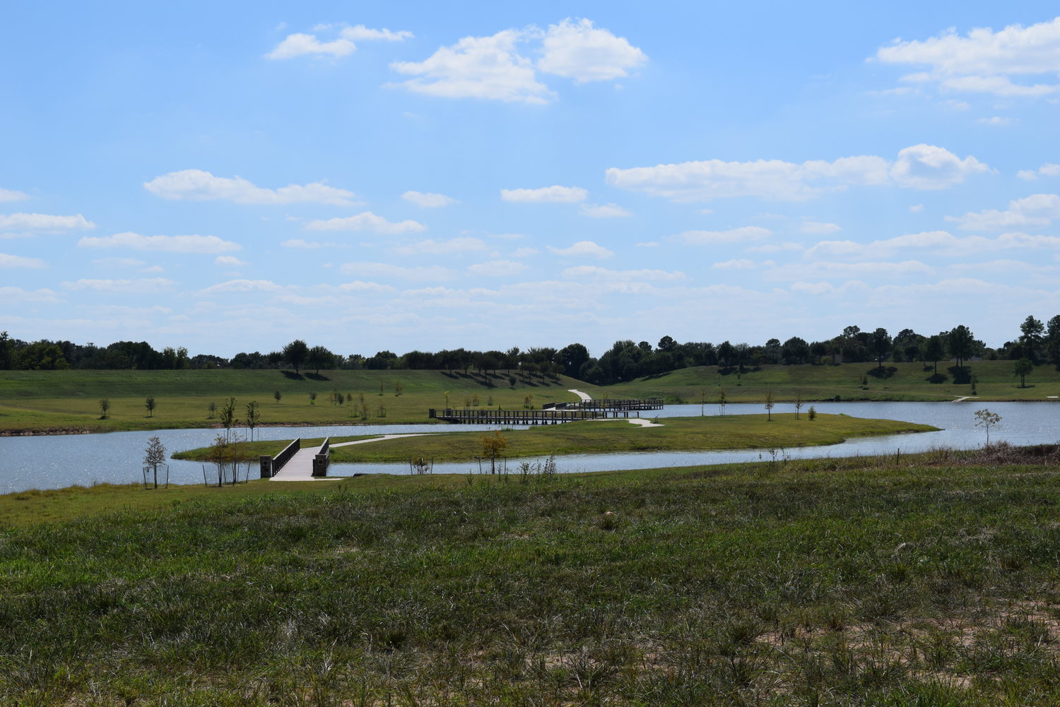 A large pond with native vegetation and walking trails is part of the parkland in the Katy Boardwalk District. The inclusion of Method Architecture will help planners on the project ensure that lakefront views are optimized for visitors and for Katy residents who are expected to use the area as a city park.