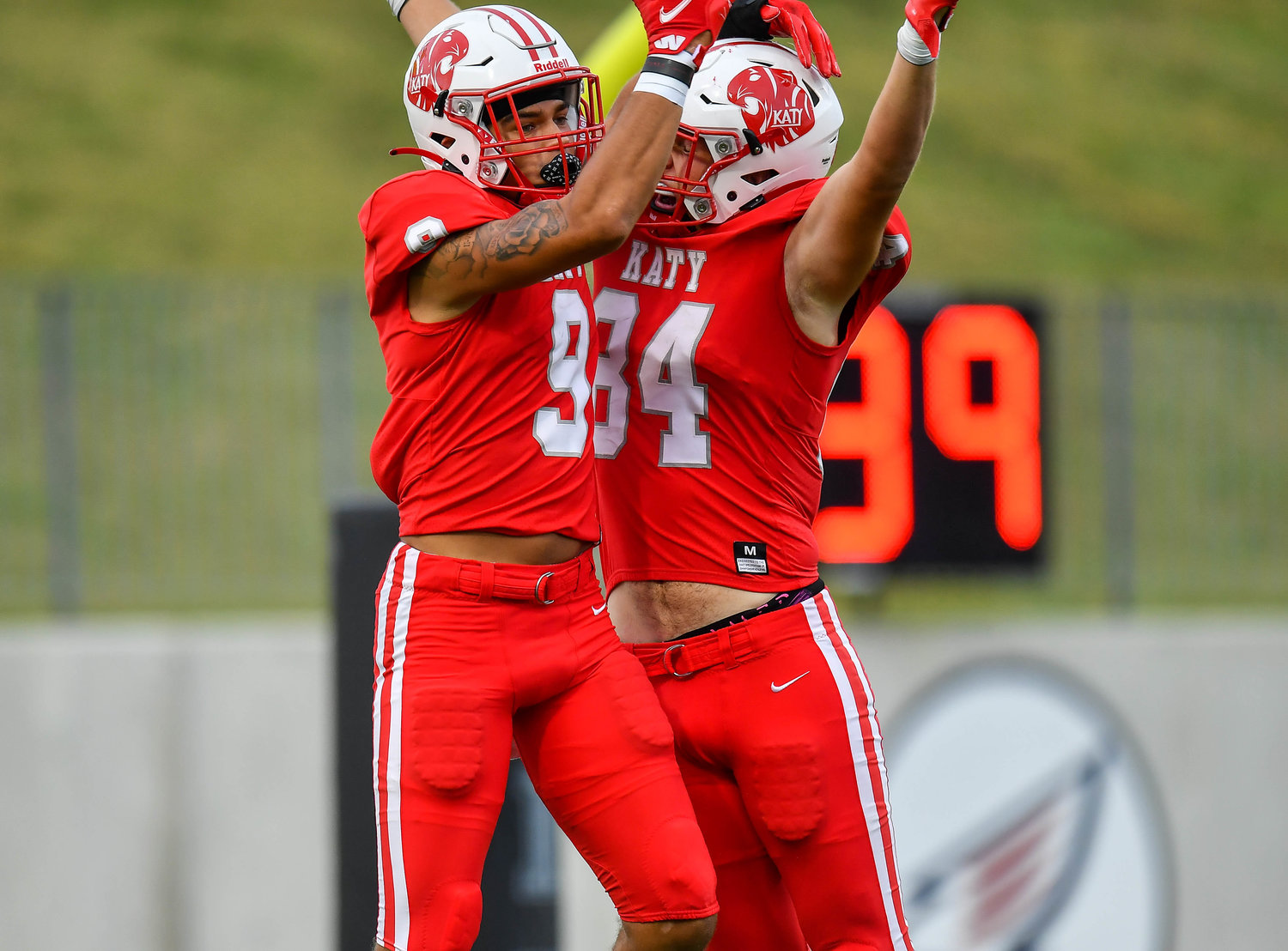 Katy, Tx. Oct. 1, 2021: Katy's #9 Antonio Silva and Katy's #84 Luke Carter celebrate a TD during a game between Katy Tigers and Tompkins Falcons at Legacy Stadium in Katy. (Photo by Mark Goodman / Katy Times)