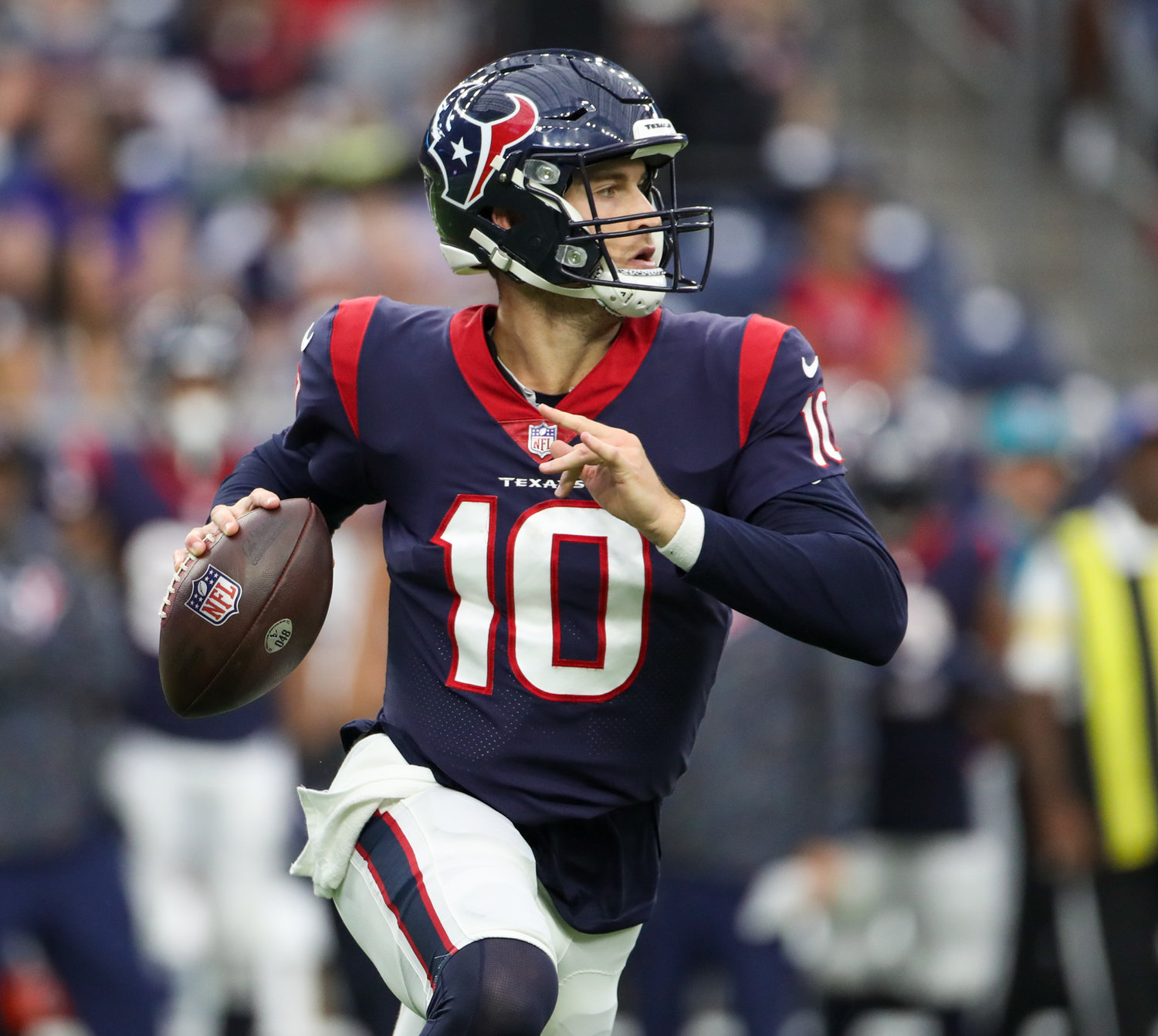 Houston Texans quarterback Davis Mills runs with the ball during an NFL game between Houston and New England on October 10, 2021 in Houston, Texas. The Patriots won 25-22.