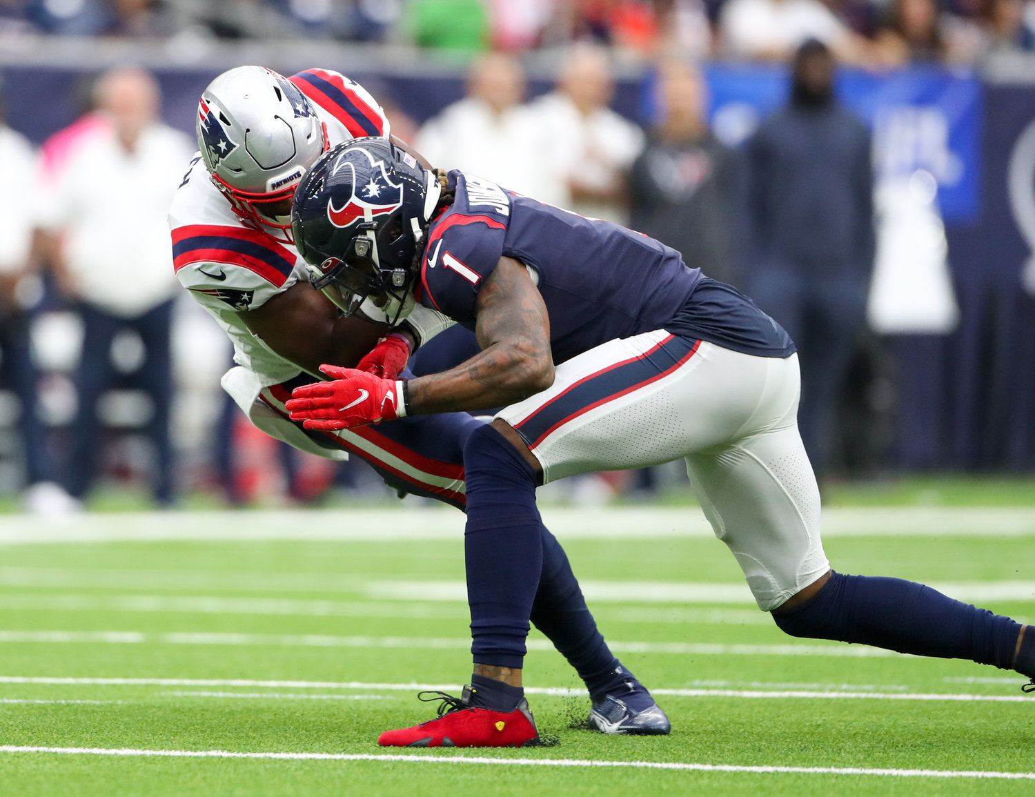 Houston Texans safety Lonnie Johnson (1) is flagged for unnecessary roughness for this helmet-to-helmet hit on New England Patriots tight end Jonnu Smith (81) during an NFL game between Houston and New England on October 10, 2021 in Houston, Texas.