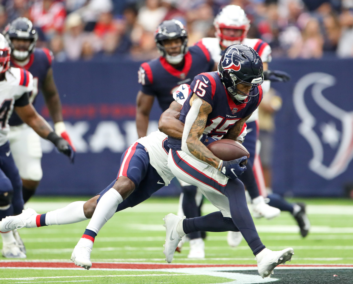 Houston Texans wide receiver Chris Moore (15) bobbles and then secures a pass during an NFL game between Houston and New England on October 10, 2021 in Houston, Texas. The Patriots won 25-22.