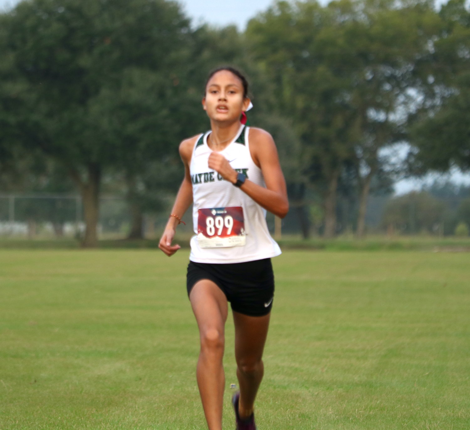 Rachel Solano runs towards the finish line during Tuesday's District 19-6A meet at Paul Rushing Park.
