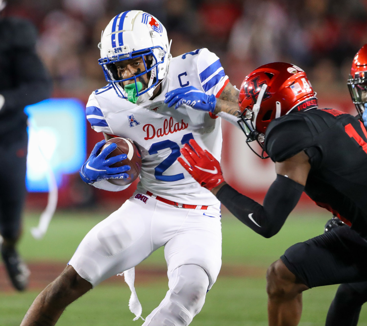 SMU Mustangs wide receiver Reggie Roberson Jr. (21) carries the ball after a reception during an NCAA football game between Houston and SMU on October 30, 2021 in Houston, Texas.