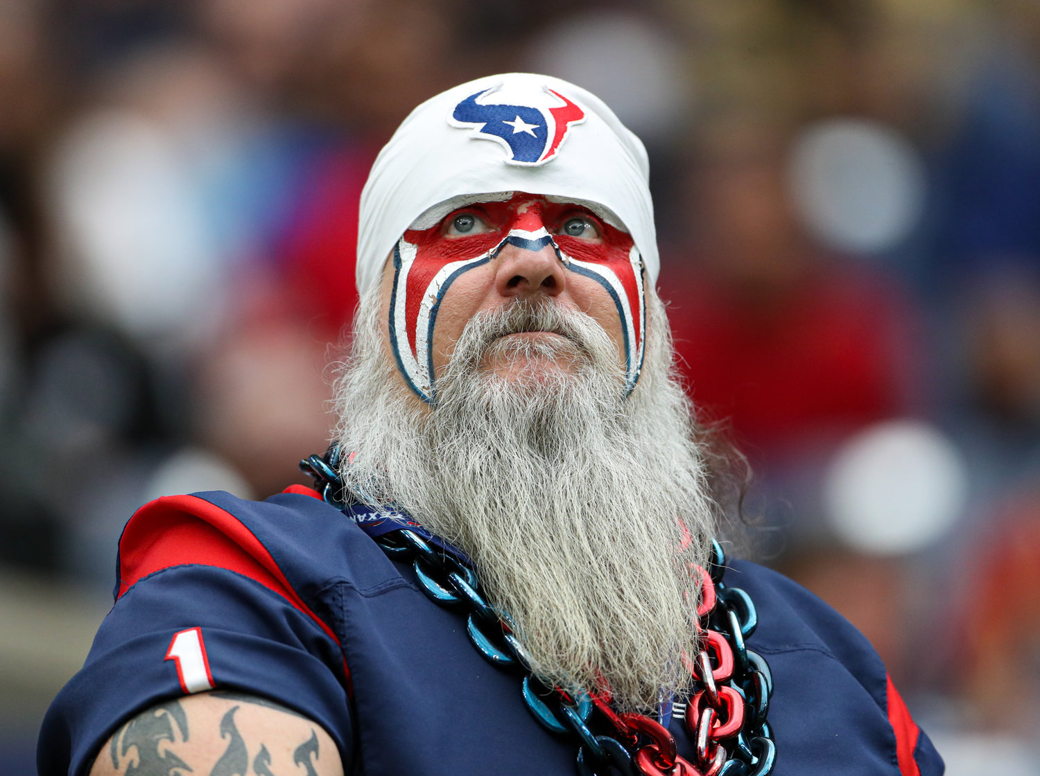 A Houston Texans fan watches the video board during an NFL game between Houston and the Los Angeles Rams on October 31, 2021 in Houston, Texas.