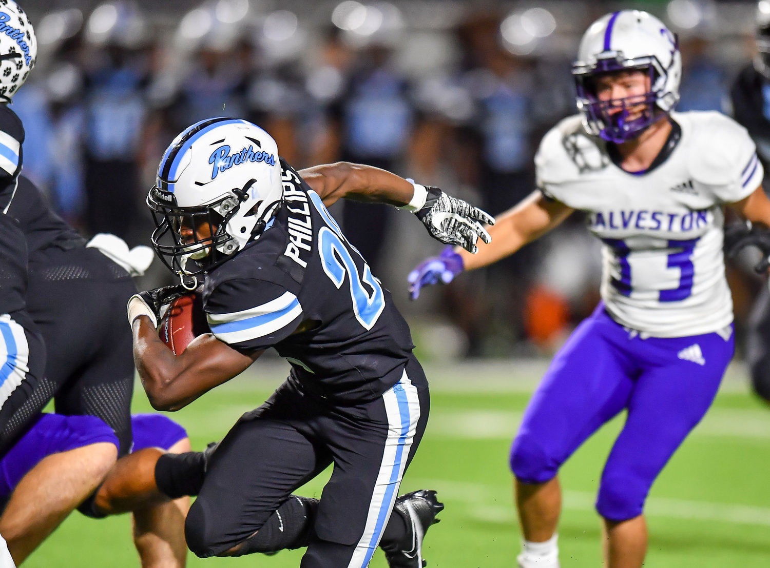 Katy, Tx. Nov 11, 2021: Paetow's Damyrion Phillips #22 carries the ball up the middle during a playoff game between Paetow and Galveston Ball  at Legacy Stadium in Katy. (Photo by Mark Goodman / Katy Times)