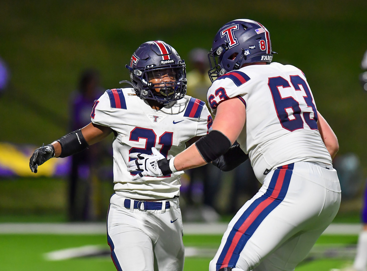 Houston Tx. Nov 19, 2021, 2021: Tompkins #21 Caleb Blocker celebrates a TD with #63 Ashton Funk during the UIL area playoff game between Tompkins and Jersey Village at Pridgeon Stadium in Houston.. (Photo by Mark Goodman / Katy Times)