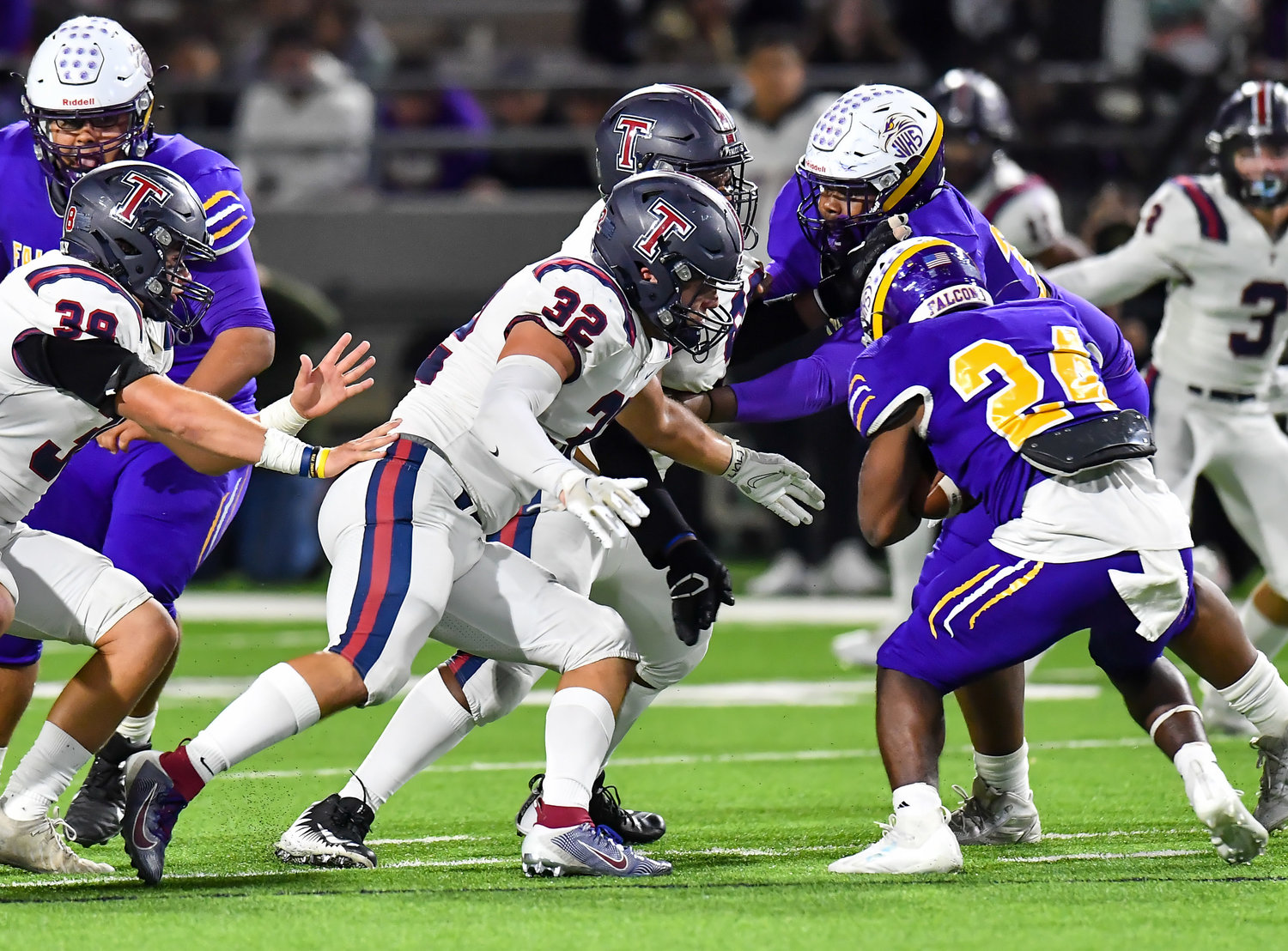 Houston Tx. Nov 19, 2021: Tompkins #32 Bryce Shaink makes the stop on Jersey Village, Rashon Estes #24 during the UIL area playoff game between Tompkins and Jersey Village at Pridgeon Stadium in Houston. (Photo by Mark Goodman / Katy Times)