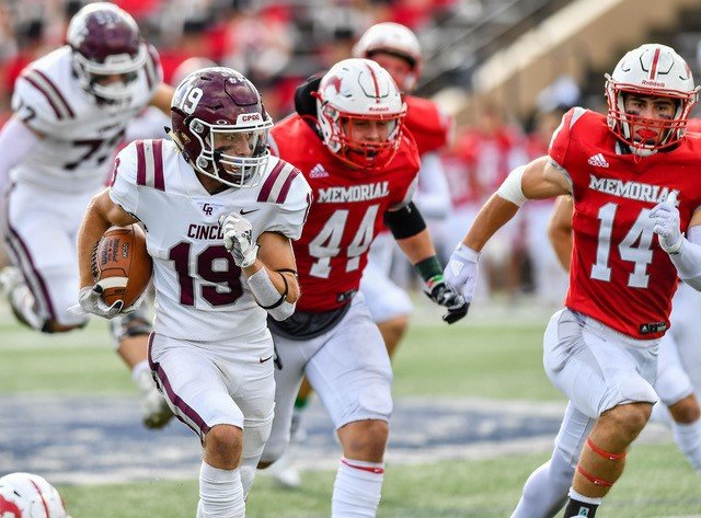 Cinco Ranch's Noah About #19 rushes for TD during the first half of their UIL area playoff game against Memorial at Tully Stadium in Houston.