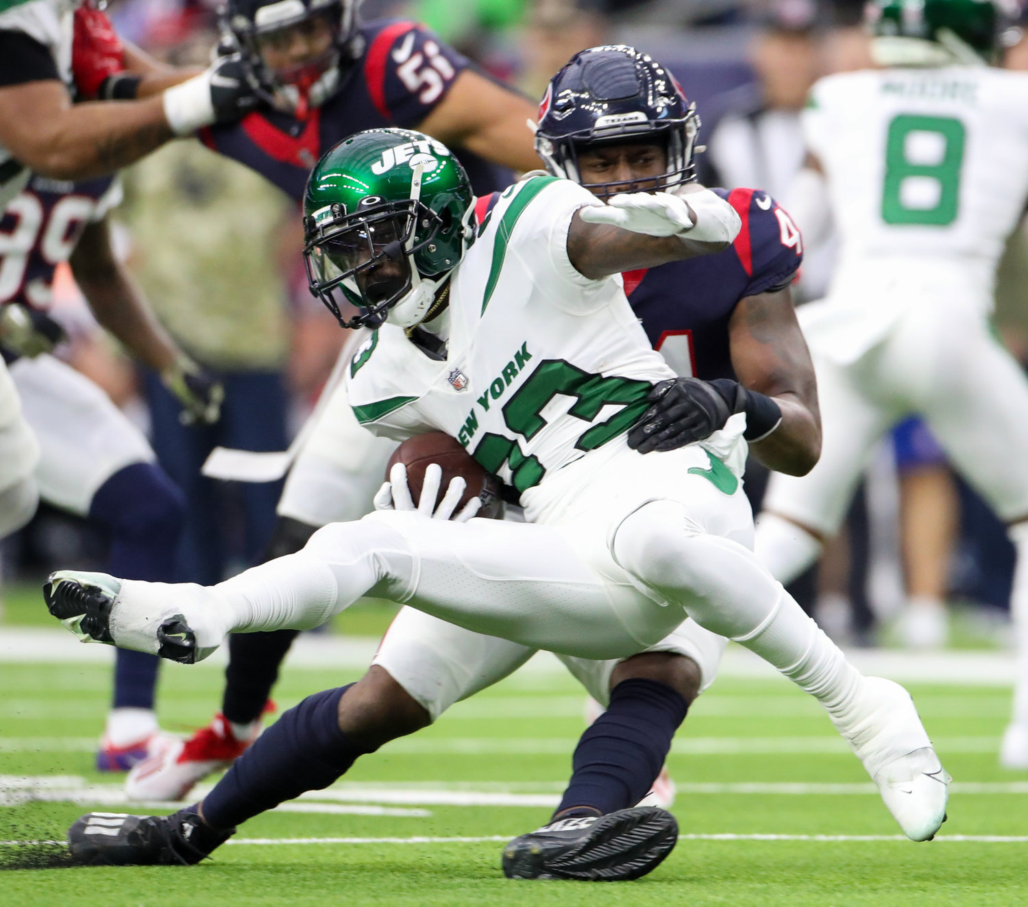Houston Texans linebacker Zach Cunningham (41) stops New York Jets running back Tevin Coleman (23) for a loss during an NFL game between the Houston Texans and the New York Jets on November 28, 2021 in Houston, Texas. The Jets won, 21-14