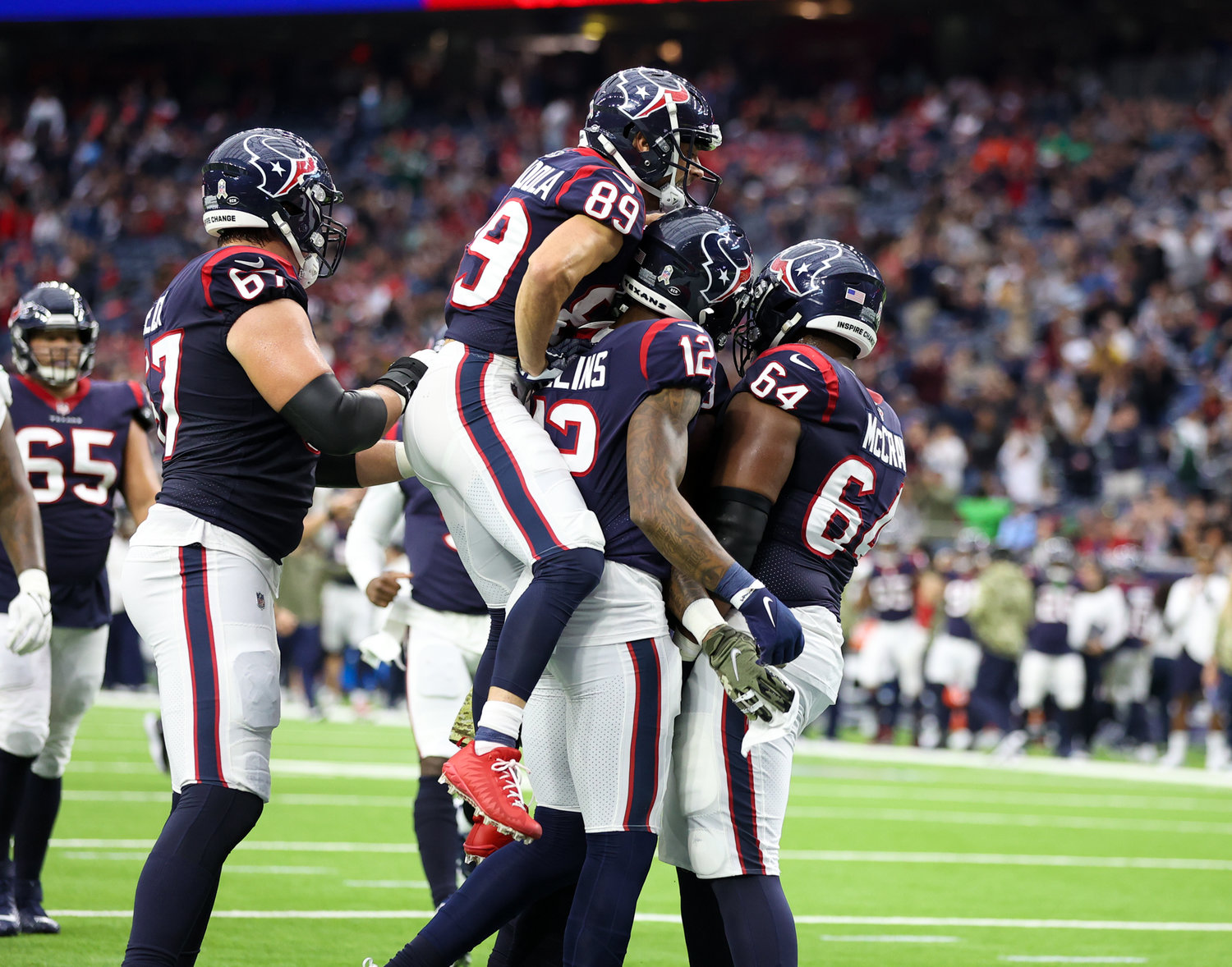The Houston Texans celebrate a touchdown during an NFL game between the Houston Texans and the New York Jets on November 28, 2021 in Houston, Texas.