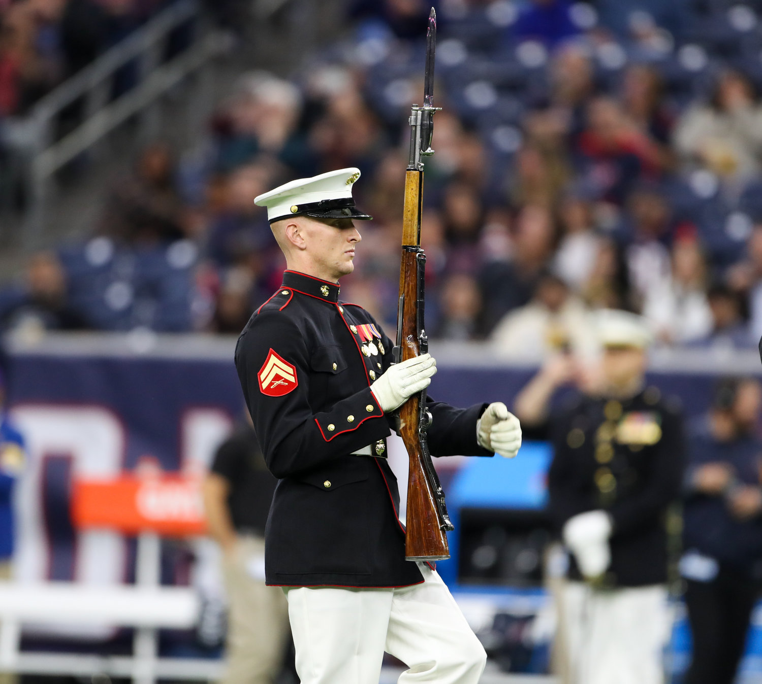 The United States Marine Corps Silent Drill Platoon performs during halftime at an NFL game between the Houston Texans and the New York Jets on November 28, 2021 in Houston, Texas.