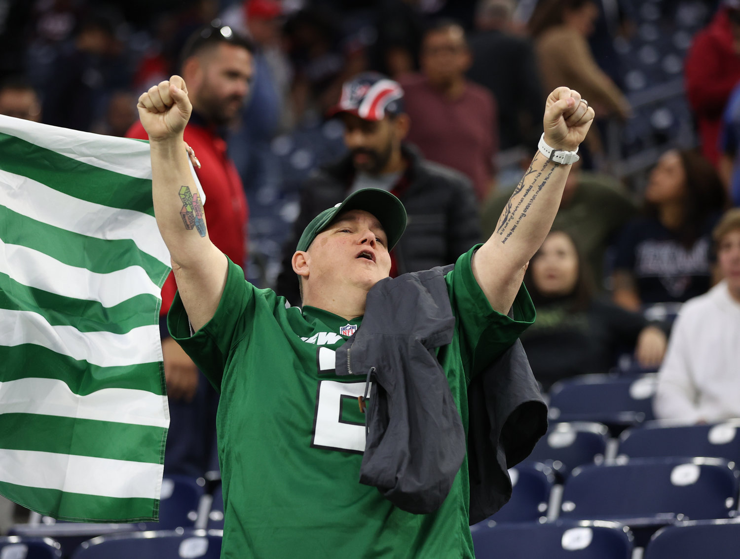 A New York Jets fan celebrates a 21-14 win over the Texans on November 28, 2021 in Houston, Texas.