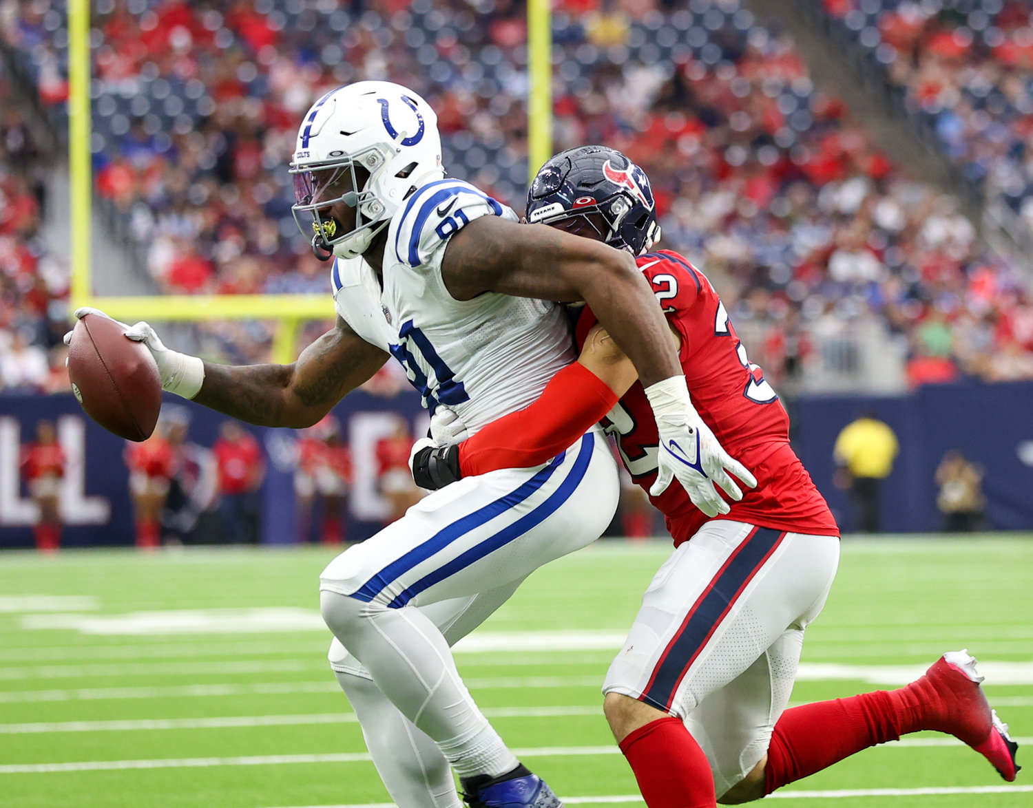 Houston Texans linebacker Garret Wallow (32) tackles Indianapolis Colts tight end Mo Alie-Cox (81) after a catch during an NFL game between the Texans and the Colts on December 5, 2021 in Houston, Texas. The Colts won, 31-0.