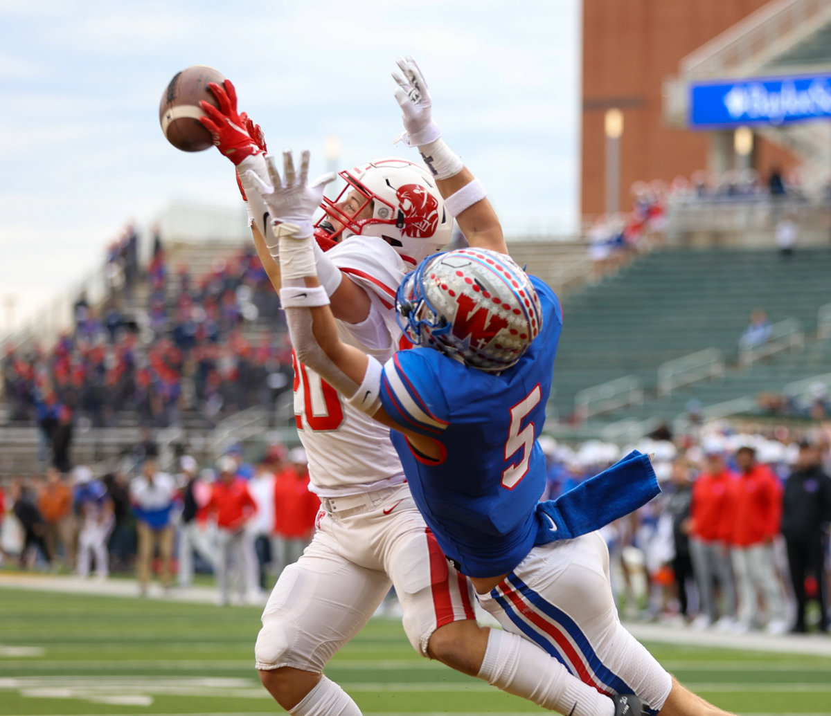 Katy Tigers defensive back Brady Englett (20) breaks up a would-be touchdown pass intended for Westlake Chaparrals wide receiver Keaton Kubecka (5) during the Class 6A Division II state semifinal  game between Katy and Westlake on December 11, 2021 in Waco, Texas.
