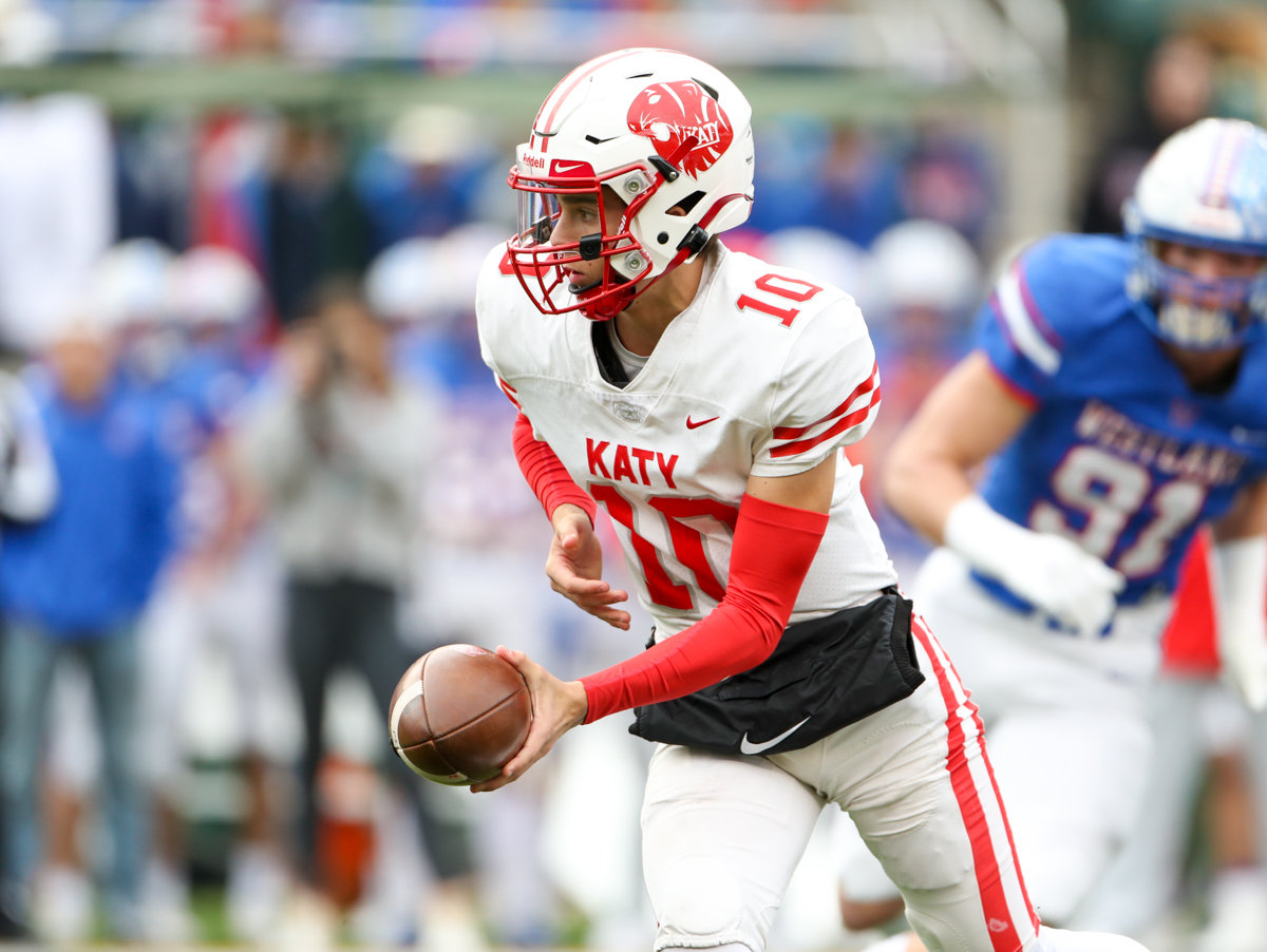 Katy Tigers quarterback Caleb Koger (10) hands the ball off during the Class 6A Division II state semifinal  game between Katy and Westlake on December 11, 2021 in Waco, Texas.