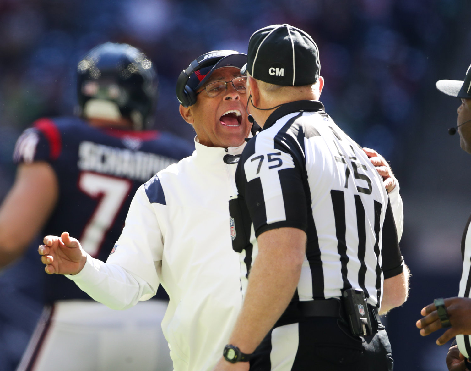 Houston Texans head coach David Culley talks with line judge Mark Stewart (75) after offensive pass interference is called against the Texans during the first half of an NFL game between the Seahawks and the Texans on December 12, 2021 in Houston, Texas.
