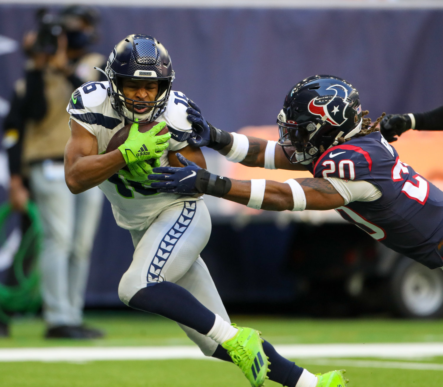 Seattle Seahawks wide receiver Tyler Lockett (16) brings in a touchdown pass over Houston Texans safety Justin Reid (20) during the first half of an NFL game between the Seahawks and the Texans on December 12, 2021 in Houston, Texas.