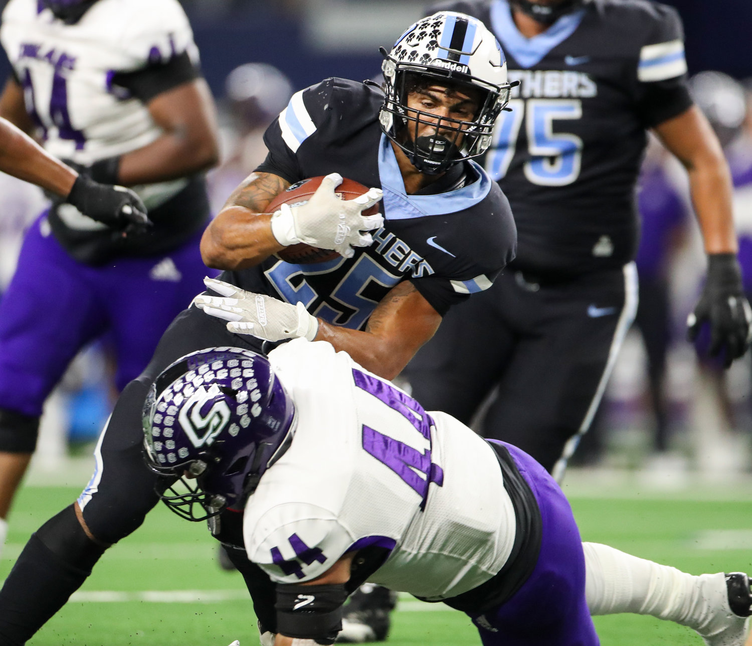 Paetow Panthers running back Jacob Brown (25) is tackled on a carry during the Class 5A-Division I state football championship game between Paetow and College Station on December 17, 2021 in Arlington, Texas.