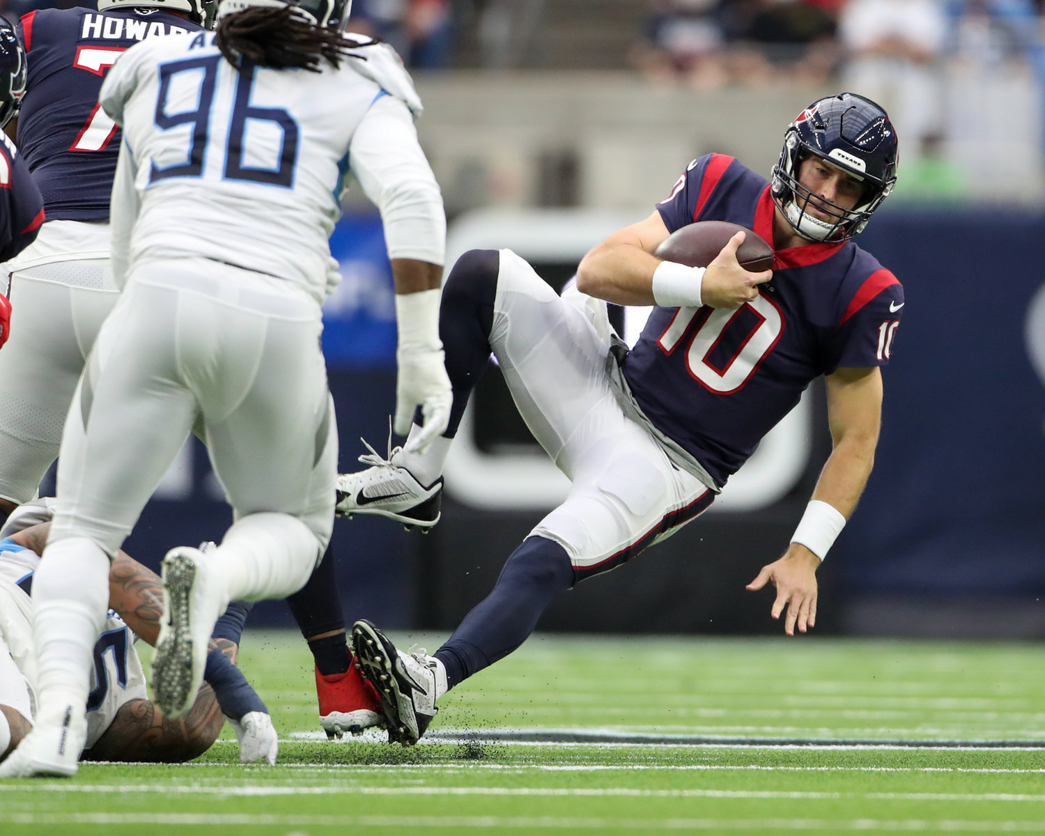 Houston Texans quarterback Davis Mills (10) is sacked during an NFL game between the Texans and the Titans on Jan. 9, 2022 in Houston, Texas.
