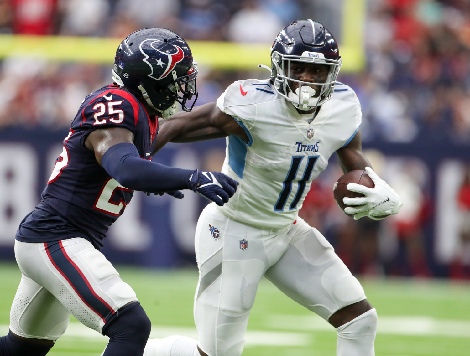 Tennessee Titans wide receiver A.J. Brown (11) carries the ball after a catch during an NFL game between the Texans and the Titans on Jan. 9, 2022 in Houston, Texas.