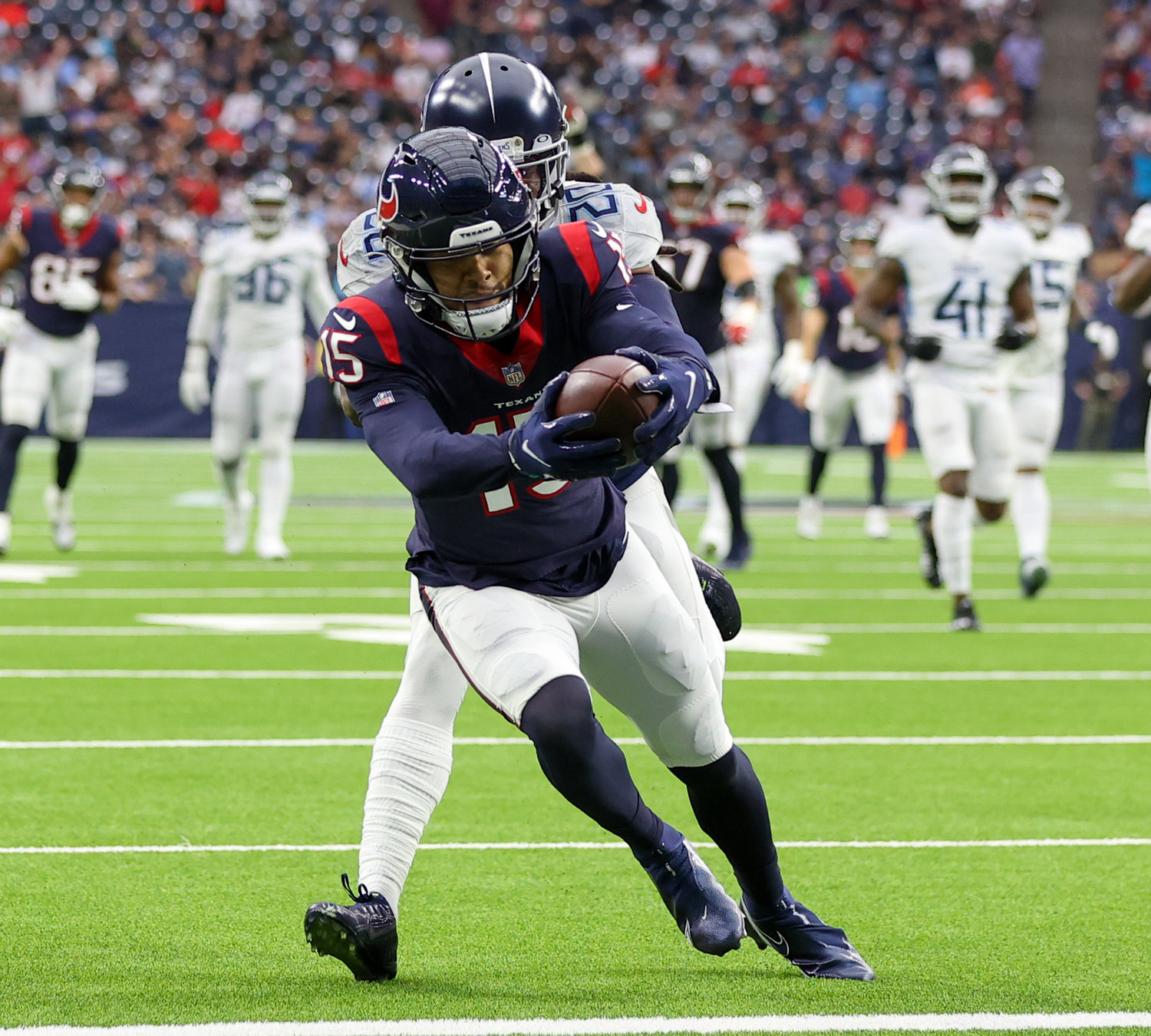 Houston Texans wide receiver Chris Moore (15) makes a 28-yard touchdown catch in the third quarter of an NFL game between the Texans and the Titans on Jan. 9, 2022 in Houston, Texas. The Titans won, 28-25.
