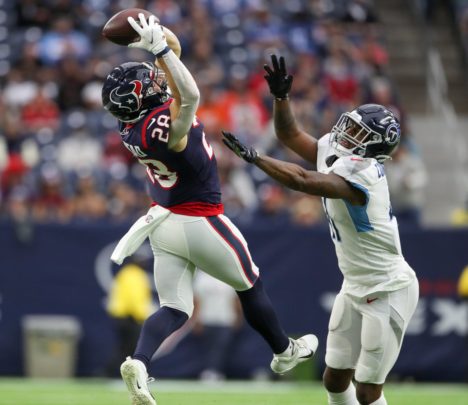 Houston Texans running back Rex Burkhead (28) brings in a pass for a first down during an NFL game between the Texans and the Titans on Jan. 9, 2022 in Houston, Texas. The Titans won, 28-25.