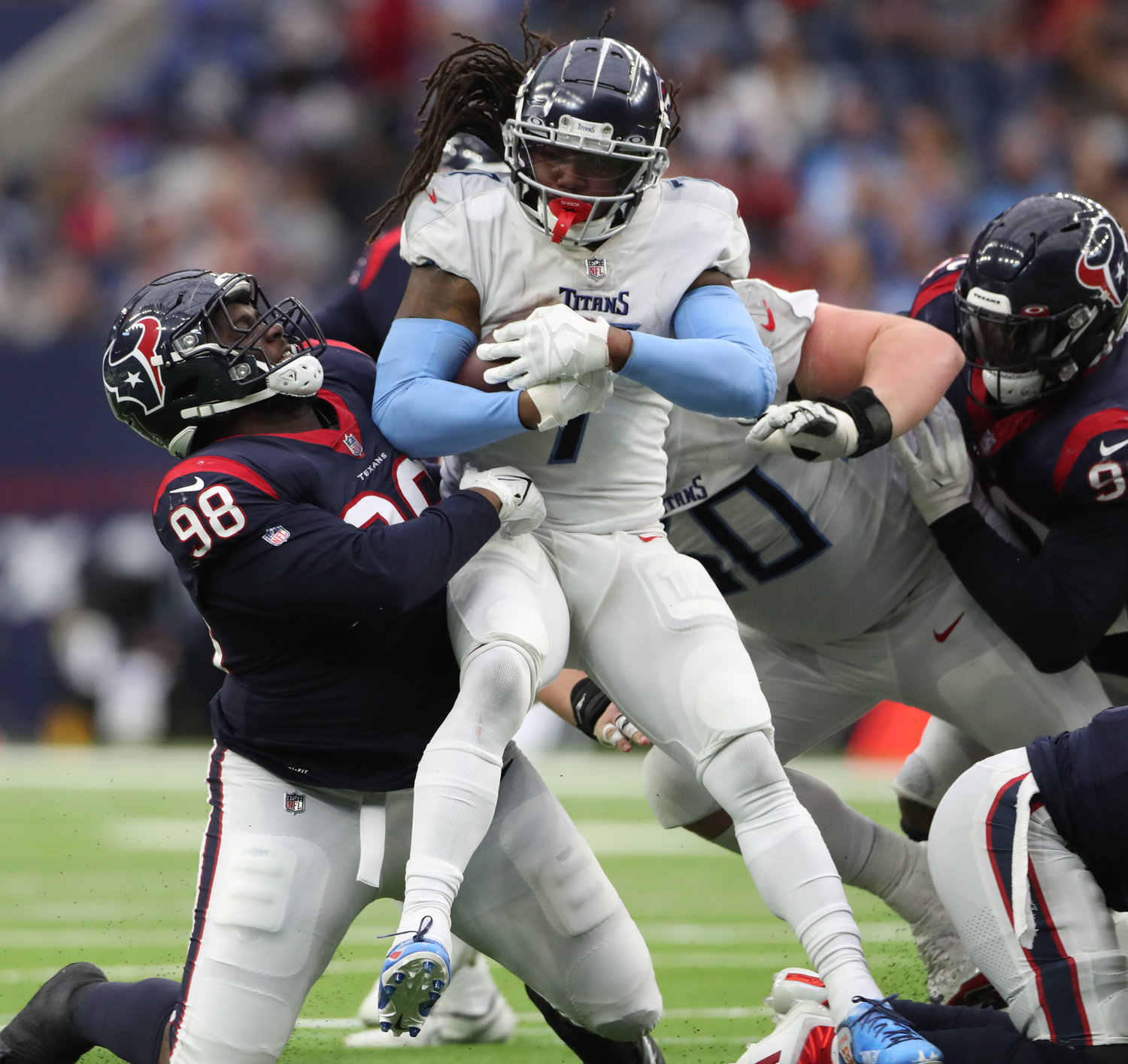 Houston Texans defensive end Michael Dwumfour (98) tackles Tennessee Titans running back D'Onta Foreman (7) for a loss during an NFL game on Jan. 9, 2022 in Houston, Texas. The Titans won, 28-25.