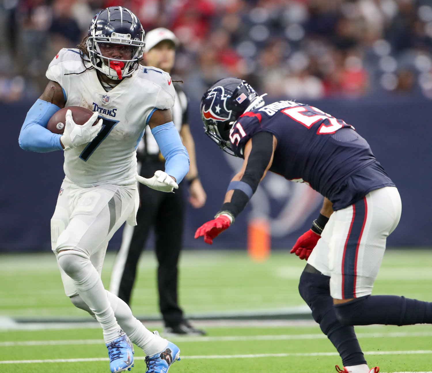 Tennessee Titans running back D'Onta Foreman (7) carries the ball during an NFL game between the Texans and the Titans on Jan. 9, 2022 in Houston, Texas. The Titans won, 28-25.
