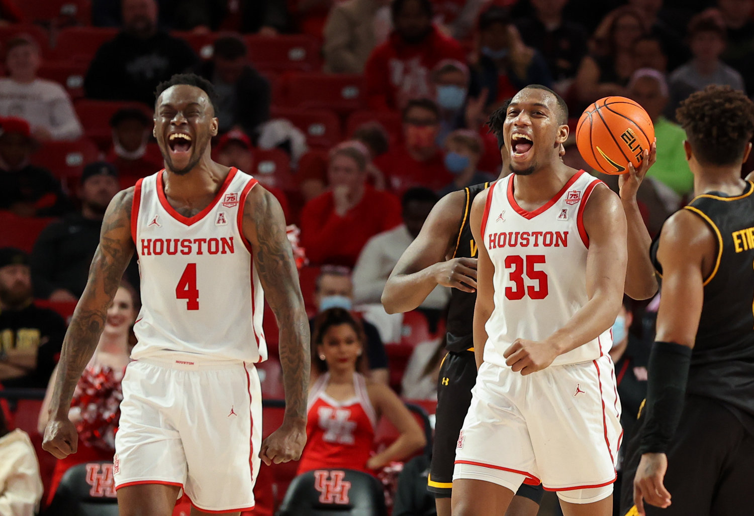 Houston Cougars guard Taze Moore (4) and forward Fabian White Jr. (35) react after blocking a shot during an NCAA men’s basketball game between Houston and Wichita State on Jan. 8, 2022 in Houston, Texas.