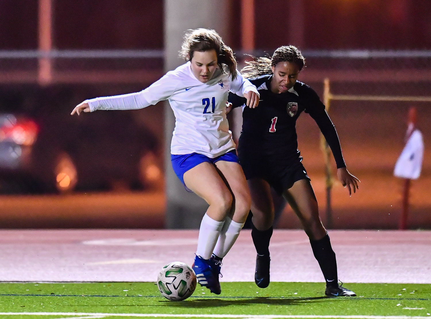 March 8, 2022: Katy's Olyvia Witham #1 and Taylors Regan Arney #21 scramble for the ball during the Katy vs Katy Taylor soccer match at KHS. (Photo by Mark Goodman / Katy Times)
