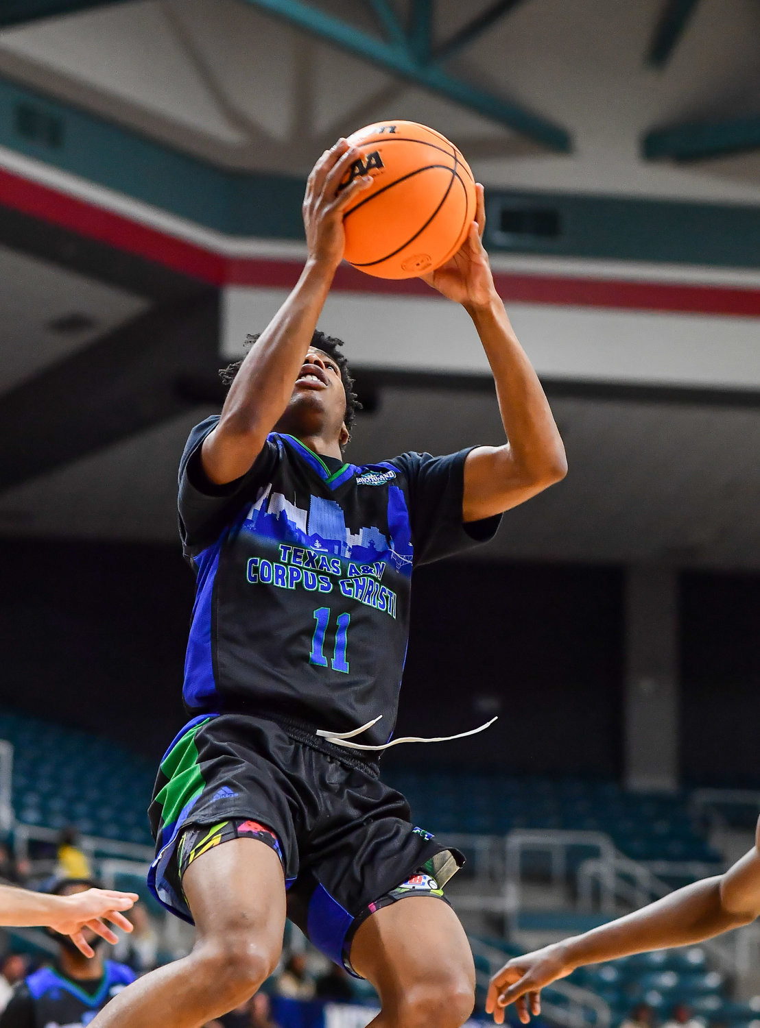 March 12,, 2022:  A&M-Corpus Christis Terrion Murdix #11 drives up to the basket during the Southland Conference Basketball Championship game between A&M Corpus Christi vs Southeastern Louisiana. (Photo by Mark Goodman / Katy Times)