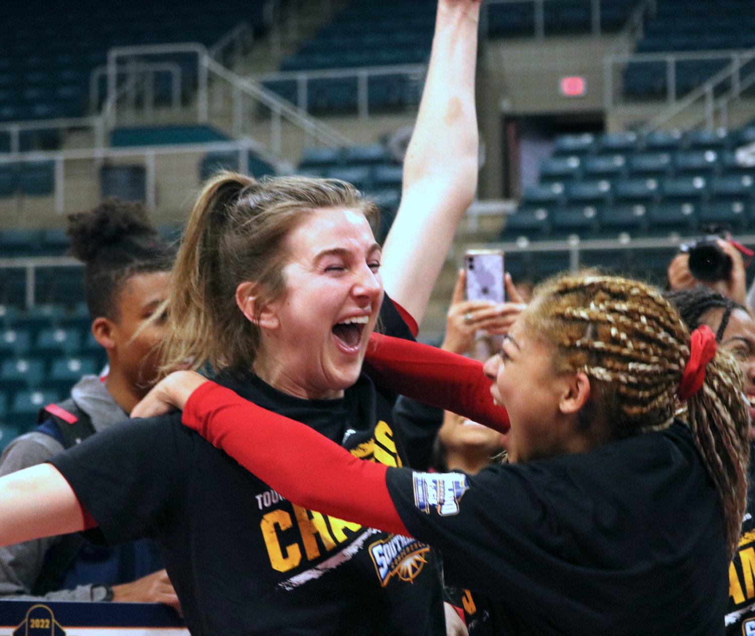 Chloe Storer and Destiny Jenkins celebrate after winning Sunday’s Southland Tournament Final at the Merrell Center between the University of Incarnate Word and Southeastern Louisiana.