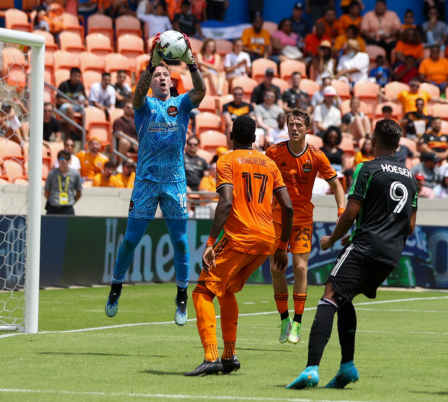 Houston Dynamo goalkeeper Steve Clark (12) leaps to make a stop during the second half of a Major League Soccer match between the Houston Dynamo and Austin FC on April 30, 2022 in Houston, Texas.