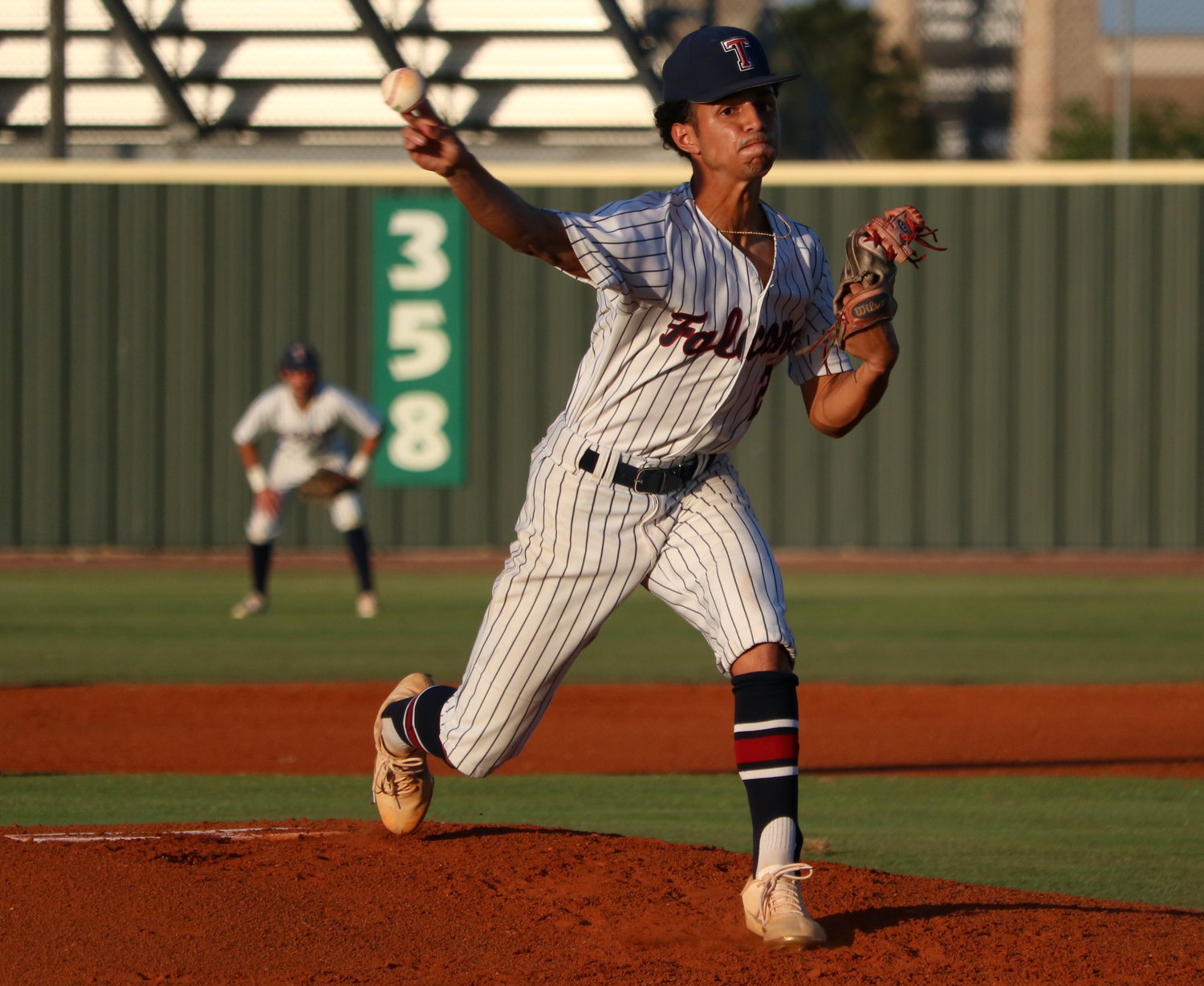 Trevor Esparza pitches during Thursday’s Class 6A area round game between Tompkins and Lamar at the Tompkins baseball field.