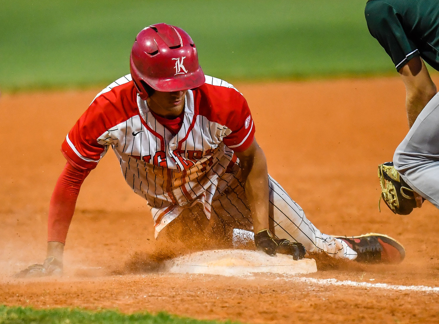 Katy's Dominic Melchor (11) slides safely into third base for a triple during the fourth inning during a Region III-6A SemiFinals baseball game between Katy and Strake Jesuit at Mayde Creek High School, Friday, May 27, 2022.