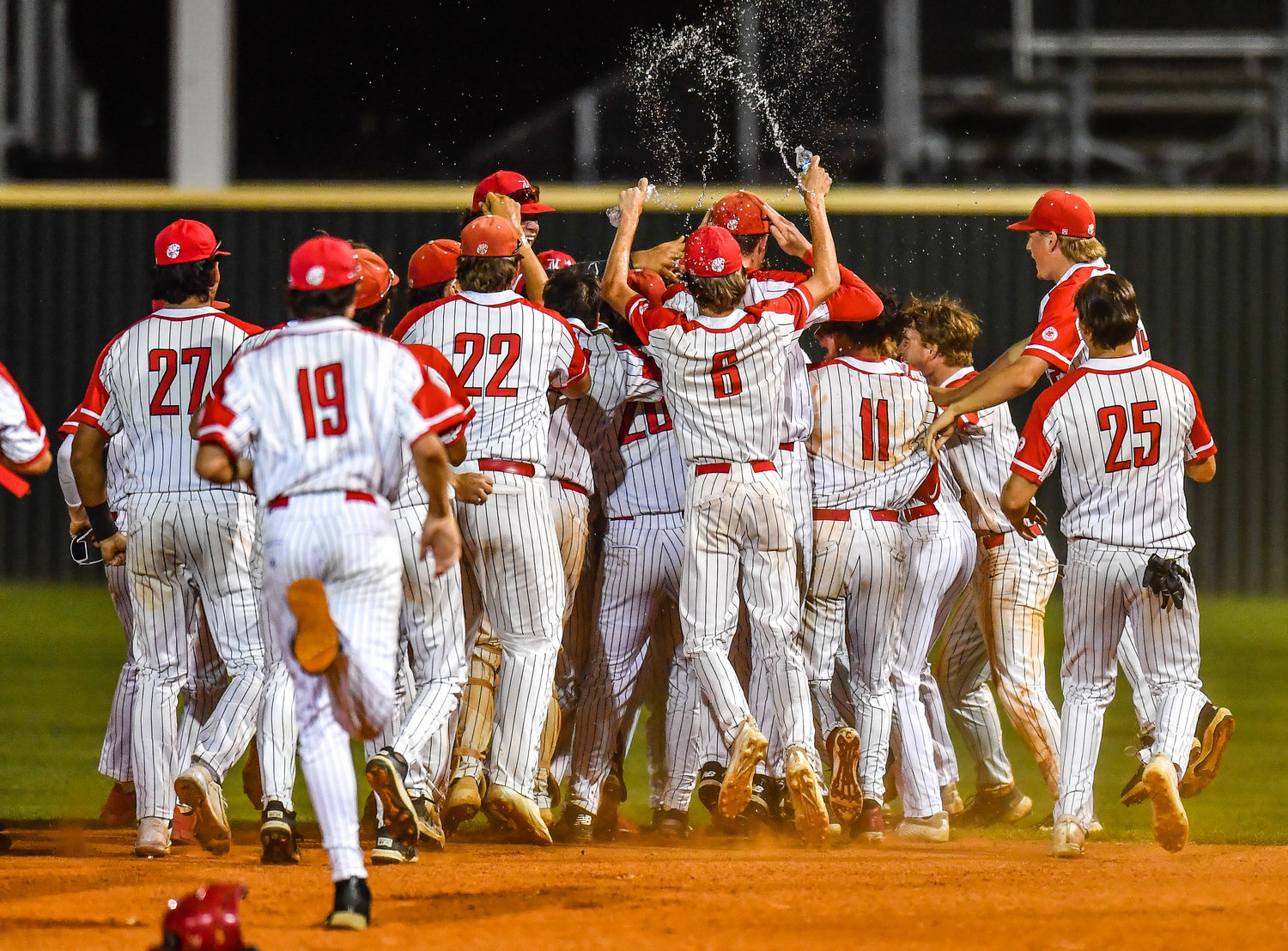 Katy Tigers celebrate victory winning game two against Strake Jesuit during a Region III-6A Semifinals game at Mayde Creek High School.