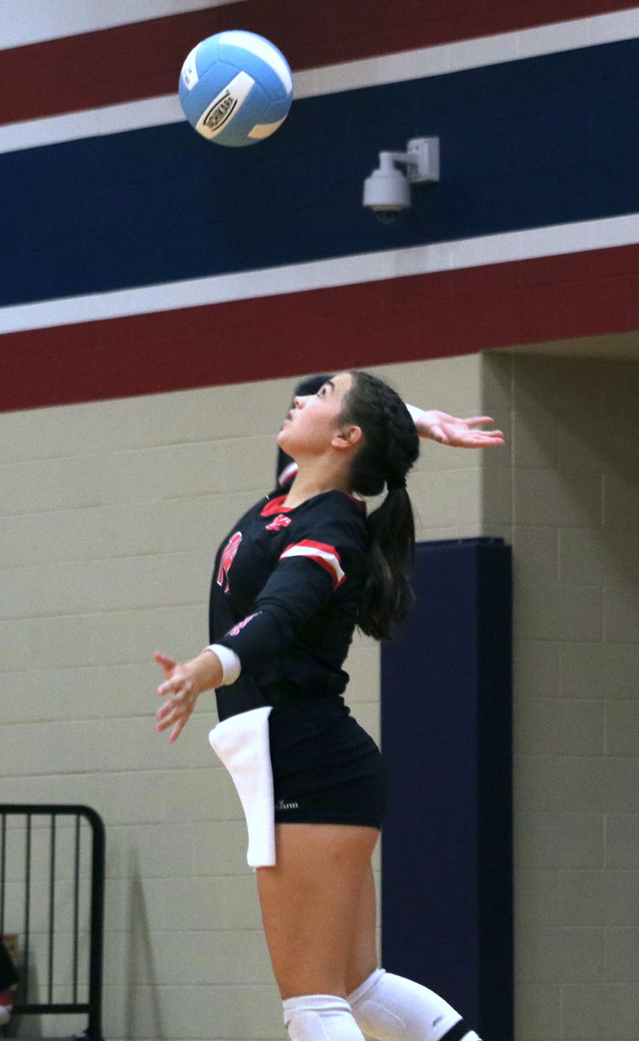 Katy’s Jessie Leach serves during Tuesday’s match between Tompkins and Katy at the Tompkins gym.