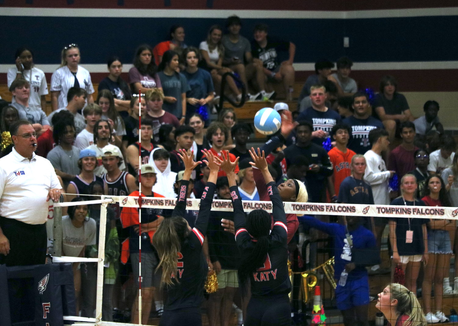 Tompkins Cindy Tchouangwa spikes a ball during Tuesday’s match between Tompkins and Katy at the Tompkins gym.