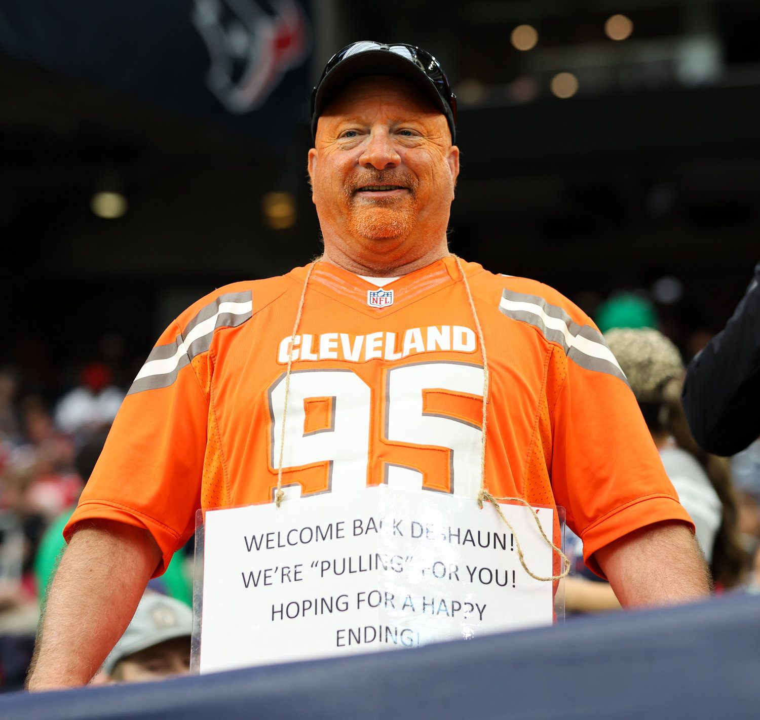 A Cleveland Browns fan wears a sign about Browns quarterback Deshaun Watson during an NFL game between the Houston Texans and the Browns on Dec. 4, 2022, in Houston. The Browns won, 27-14.