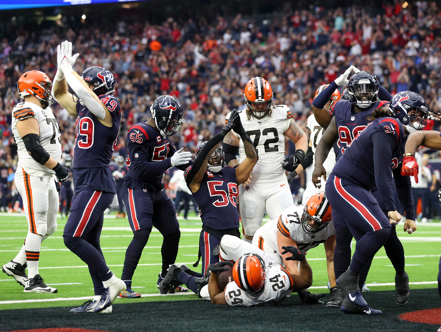 The Houston Texans defense reacts after stopping Cleveland Browns running back Nick Chubb in the end zone for a safety during an NFL game between the Houston Texans and the Cleveland Browns on Dec. 4, 2022, in Houston. The Browns won, 27-14.